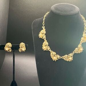 Signed Delsa gold-tone leaf and faux pearl necklace and earring set
